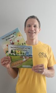 Craig Smith with two 'Little Duck' books by L.K. Brodie.
